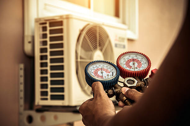 Professional Heat Pump Repair technician working in Bath, MI